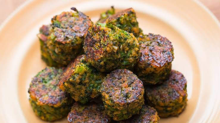 Broccoli and paneer tikki stacked on a plate