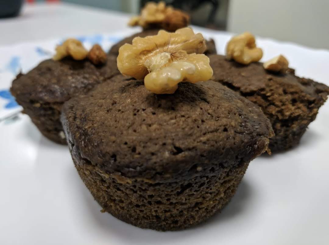Keto peanut butter muffin topped with walnuts
