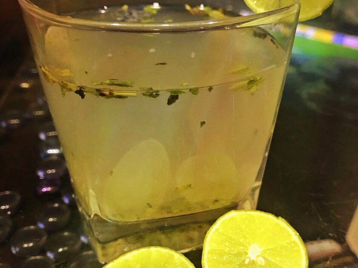 Mint lemon electrolyte water in a glass