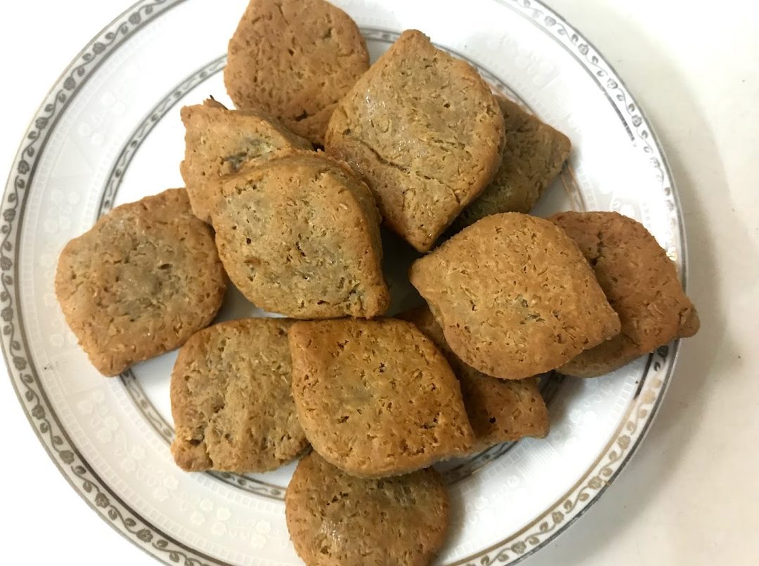 Baked almond flour biscuits cooling on a tray