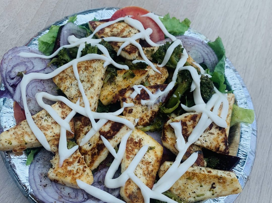 Chicken tikka salad with a mayo drizzle